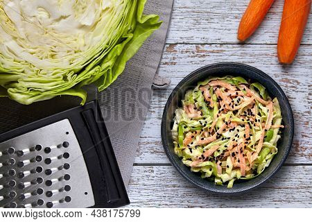 Healthy Vegetarian Food. Coleslow. White Cabbage And Carrot Salad With Black Cumin Seeds And Dressin