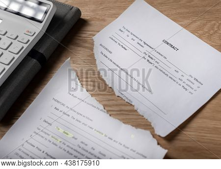 Contract Terminated Concept. Hands Breaching And Ripping Legal Business Agreement.