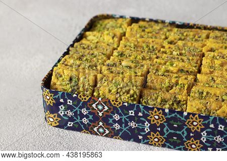 Traditional Persian Dessert Sohan From Iran In Box On Gray Background.