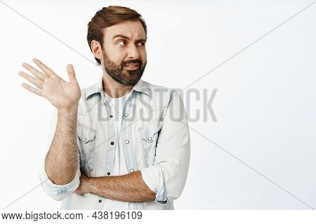 Nonsense. Annoyed Bearded Man Wave Hand And Roll Eyes At Ridiculous Accusations, Unwilling To Talk, 