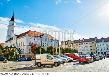 Central Square Of Small European Town With Parked Cars. Katy Wroclawskie, Poland - October 21, 2021