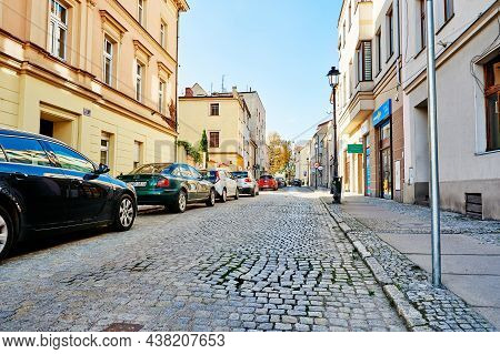 Small European City Street With Parked Cars On The Pavement. Katy Wroclawskie, Poland - October 21, 