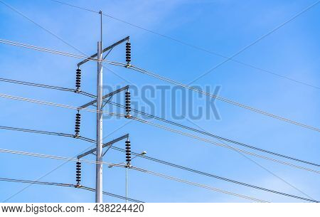 Electric Pole And Blue Sky. Power And Energy. Three-phase Electric Power For Transfer Power By Elect