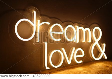 White Neon Sign With The Inscription Dream Love. Trendy Style. Wedding Design. Neon Sign. Custom Neo
