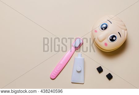 Childrens Set Of Dentist With Tools And Play Doll Head Mockup. Tablet For Recording. Copy Space Flat