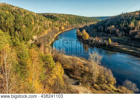 A Picturesque Top View Of The Sylva River And The Autumn Trees Growing Nearby. Photo Taken In Kurgur