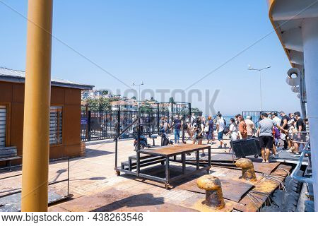 Kinaliada, Istanbul, Turkey - 07.30.2021: Crowd Of Turkish People Getting Off The Small Passenger Bo