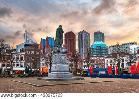 THE HAGUE, NETHERLANDS - MARCH 1, 2020: Cityscape from Buitenhof Square at dusk with the Johan de Witt statue dating from 1916.