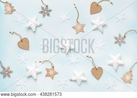 Winter New Eyer Snowy Background. Composition With Wooden Decorations Stars Christmas Tree Snowflake