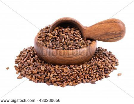 Cassia Tora Beans In Wooden Bowl And Spoon, Isolated On White Background. Sicklepod Or Senna Obtusif