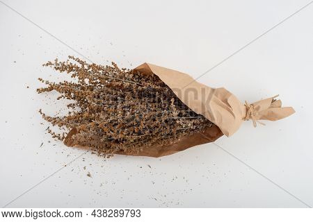 Dried Wormwood Herb, Artemisia Absinthium, Wrapped In Brown Paper.