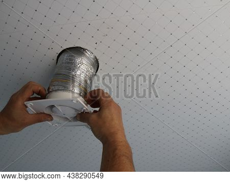 Inserting Or Removing The Duct Pipe In The Ceiling Household Hood Structure, Male Hands Insert The F