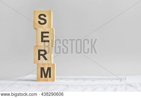 Word Serm With Wood Building Blocks, Light Gray Background. Document With Numbers On Background, Bus