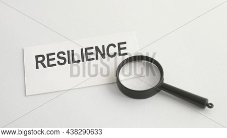 Resilience Word On Paper And Magnifying Lens