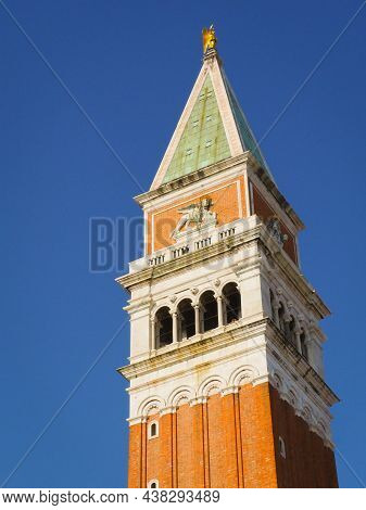Architecture And Landmark Of Venice. Venice Cityscape Sunrise. Bottom View Of The Bell Tower Of San 
