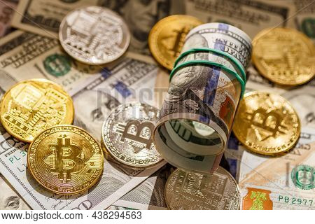 Golden Bitcoin Lies On The Banknotes.new Virtual Money. Crypto Currency Top View. Real Coins Of Bitc