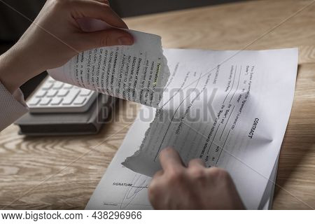 Minsk, Belarus - November 2, 2021 Contract Terminated Concept. Hands Breaching And Ripping Legal Bus
