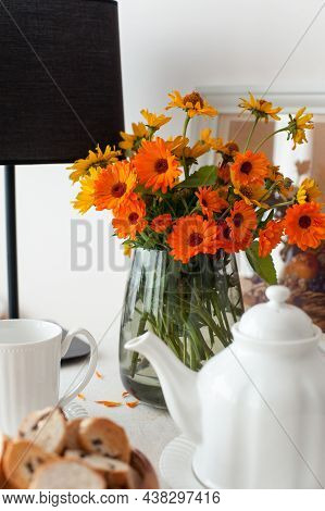 Round Table Serving For Morning Fresh Tea With A White Tablecloth And Flowers Bouquet. Set For Tea-t