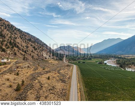 Aerial View Of Scenic Road, Hwy 3, In The Valley Around The Canadian Mountain Landscape. Near Osoyoo