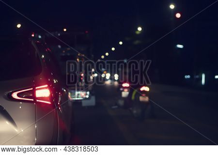 Abstract And Blurred Rear Side Of Car With Open Trail Light. Stop On The Road By Traffic Red Light C
