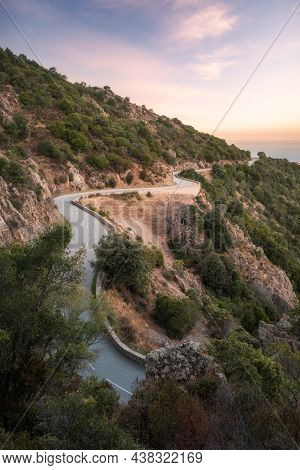 The D824 Road Winding Its Way Along The Coast From Piana Towards Capu Rossu On The West Coast Of Cor