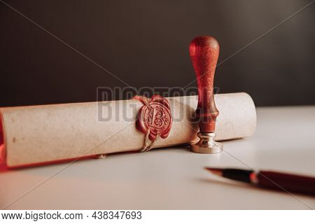 Scroll With Wax Seal Stamp Of Notary Public On A Table. Law Concept