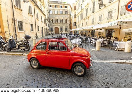 Vintage Fiat 500 Parked Next To A Restaurant In Rome In The Inner City At Quarter Regla On Cobblesto