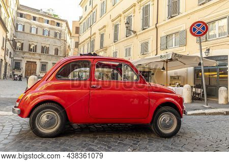 Vintage Fiat 500 Parked Next To A Restaurant In Rome In The Inner City At Quarter Regla On Cobblesto