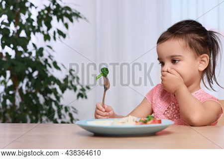 Cute Little Girl Refusing To Eat Her Breakfast At Home, Space For Text