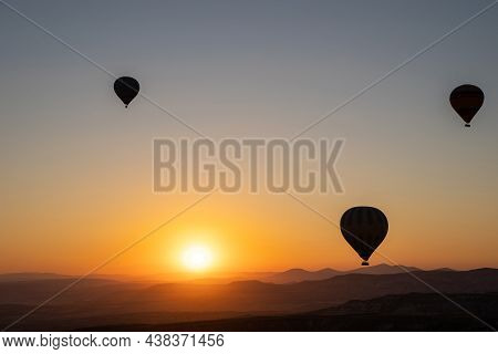 Beautiful Nature Landscape Of Countryside Mountains With Colorful High Hot Air Balloons In Summer Sk