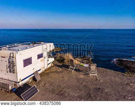 Camper Car Wild Camping On Cliff Sea Shore. Mediterranean Region Of Villaricos, Almeria, Eastern And