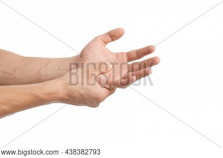 Cropped Young Caucasian Guy Presses His Hand To Sore Spot To Wrist And Suffers From Pain In Arm