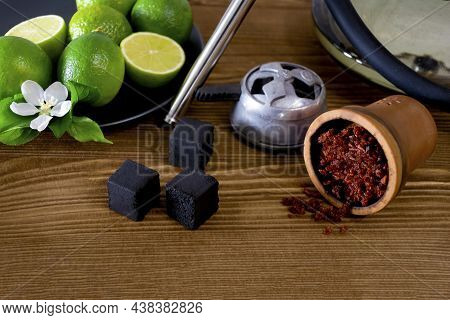 Hookah Bowl With Tobacco Citrus Fruits On Dark Background