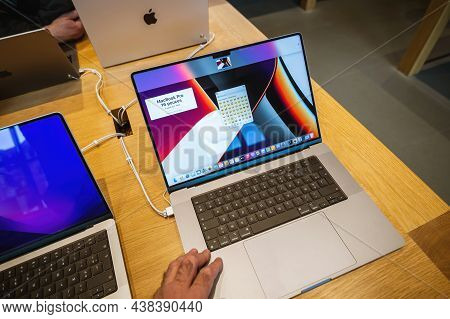Paris France - Sep 24, 2021: Male Hand Testing New Apple Computers Macbook Book Pro 16 Inch Laptop F