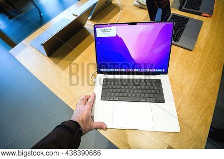 Paris, France - Sep 24, 2021: Male Hand Looking At The New Apple Computers Macbook Book Pro 16 Inch 