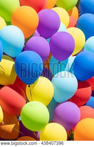 Festive Background Of Multi-colored Inflatable Balls. Children's Holiday. Decoration By Air Globs. O
