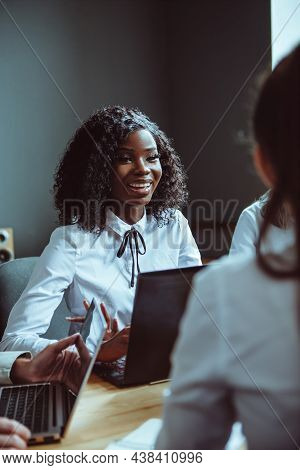 The Ambitious Afro-ameriacan Girl Discussing Financial Plans For The Company. Team Of Young Diverse 