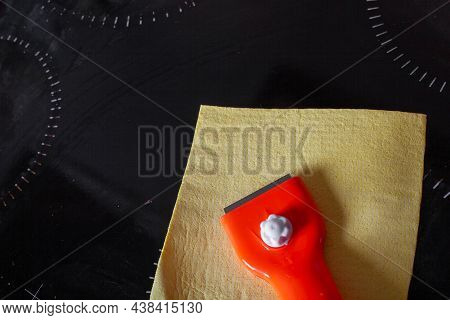 Scraper For Cleaning Glass Ceramics And A Rag For Wiping Glass Ceramic Slab Panels