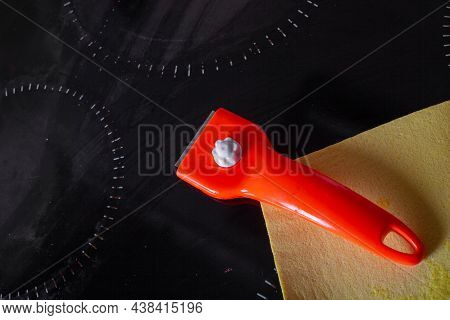 Scraper For Cleaning Glass Ceramics And A Rag For Wiping Glass Ceramic Slab Panels