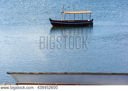 Canoes And Boats Docked On The Bank Of The Grand Paraguacu River.