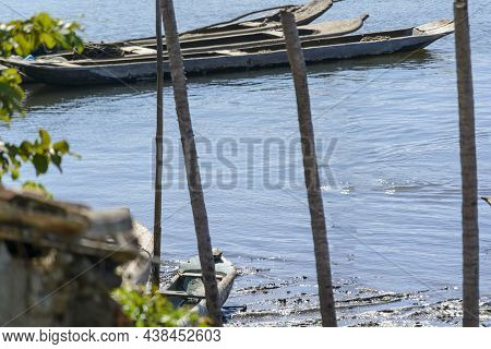 Canoes And Boats Docked On The Bank Of The Grand Paraguacu River.