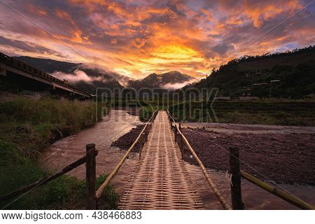 Beautiful Landscape Scenic Of The Wooden Bamboo Bridge With The Fog And Dramatic Sky Background In S