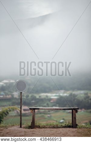 Beautiful Landscape Scenic Of The Wooden Bench And Empty Sign With The Fog In The Morning In The Cou
