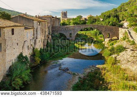 Lagrasse village with the old bridge and the Roman abbey of Saint Mary, France