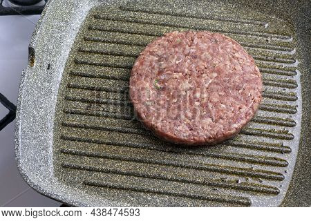 Raw Minced Meatballs With Herbs And Spices In A Grill Pan.