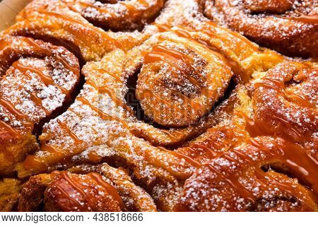 Cinnabon Cinnamon Rolls Buns With Pumpkin, Nut, Caramel And Sugar Cream Iced. Texture. Soft And Sele