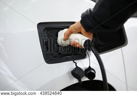 Close-up Of Hand Holding Fuel Nozzle To Add Gas At Petrol Station, Refueling Car With Diesel. Clean 