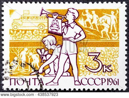 A Stamp Printed In Ussr. Boy With Clarion And Girl, Who Planted Plants Without Inscription, From The