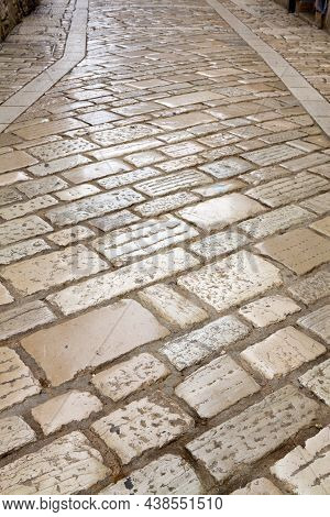 A Cobbly Pavement In The Old Town Of Porec. Porec Is A  Touristic Town On The Western Coast Of The I