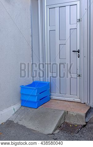 Stacked Milk Crates In Front Of Shop Door Delivery